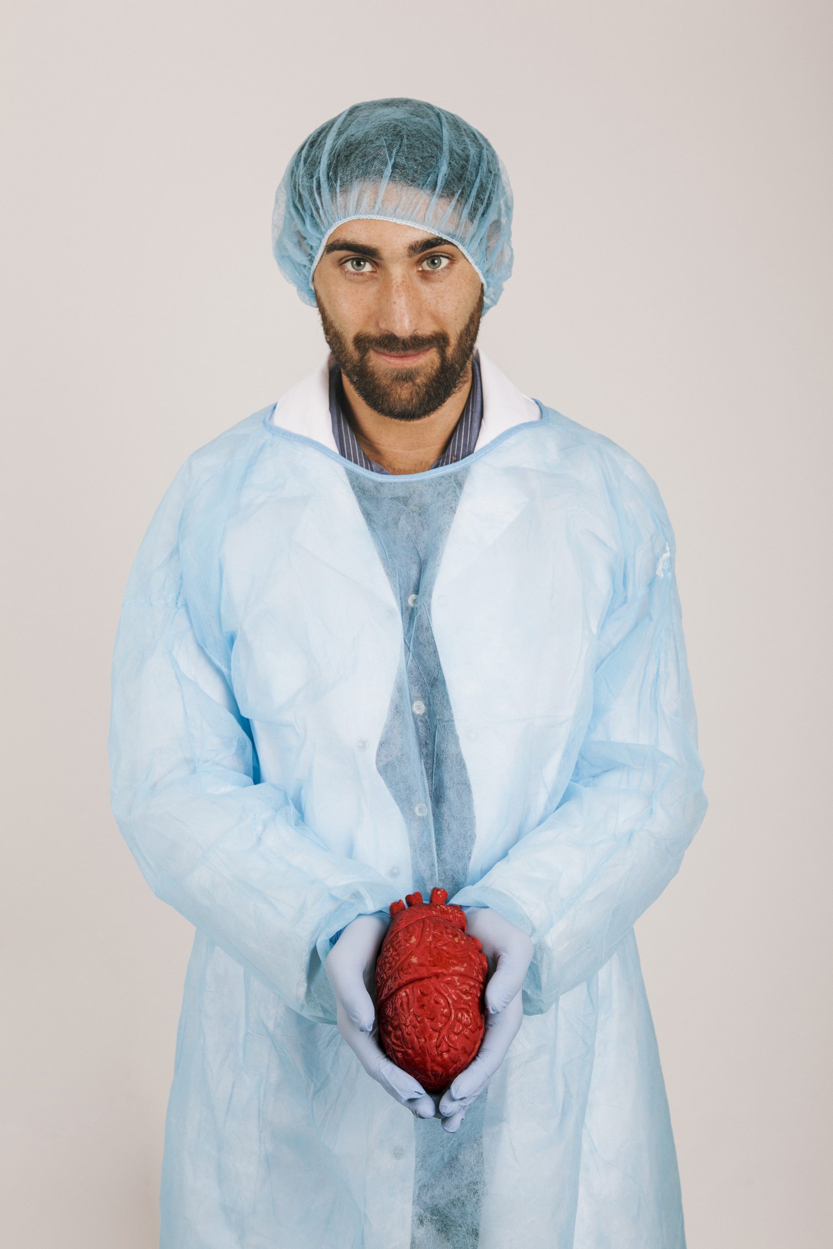 smiley surgeon holding heart
